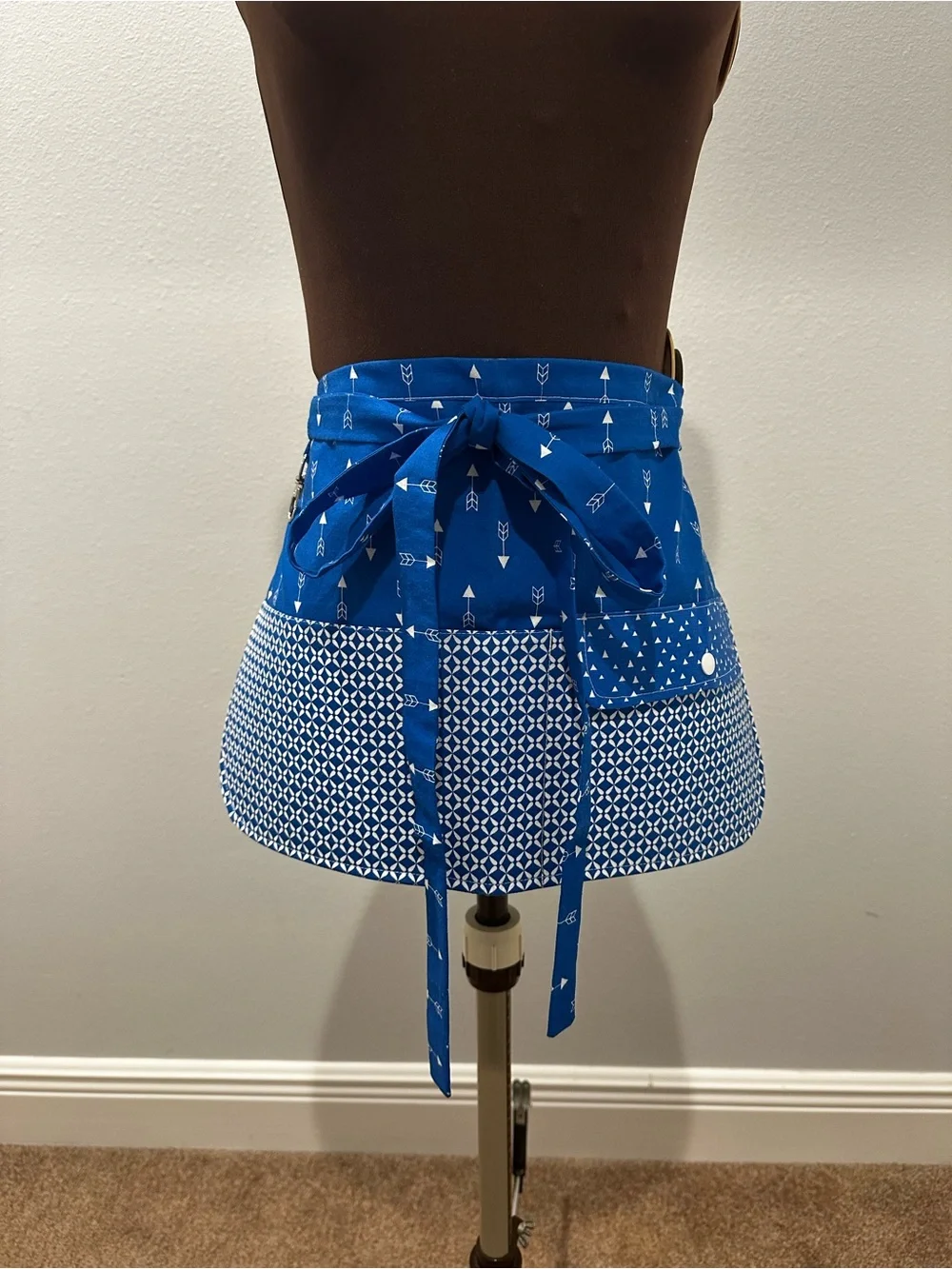 Blue Patterned Apron with Pockets across the front and a Snap Pocket